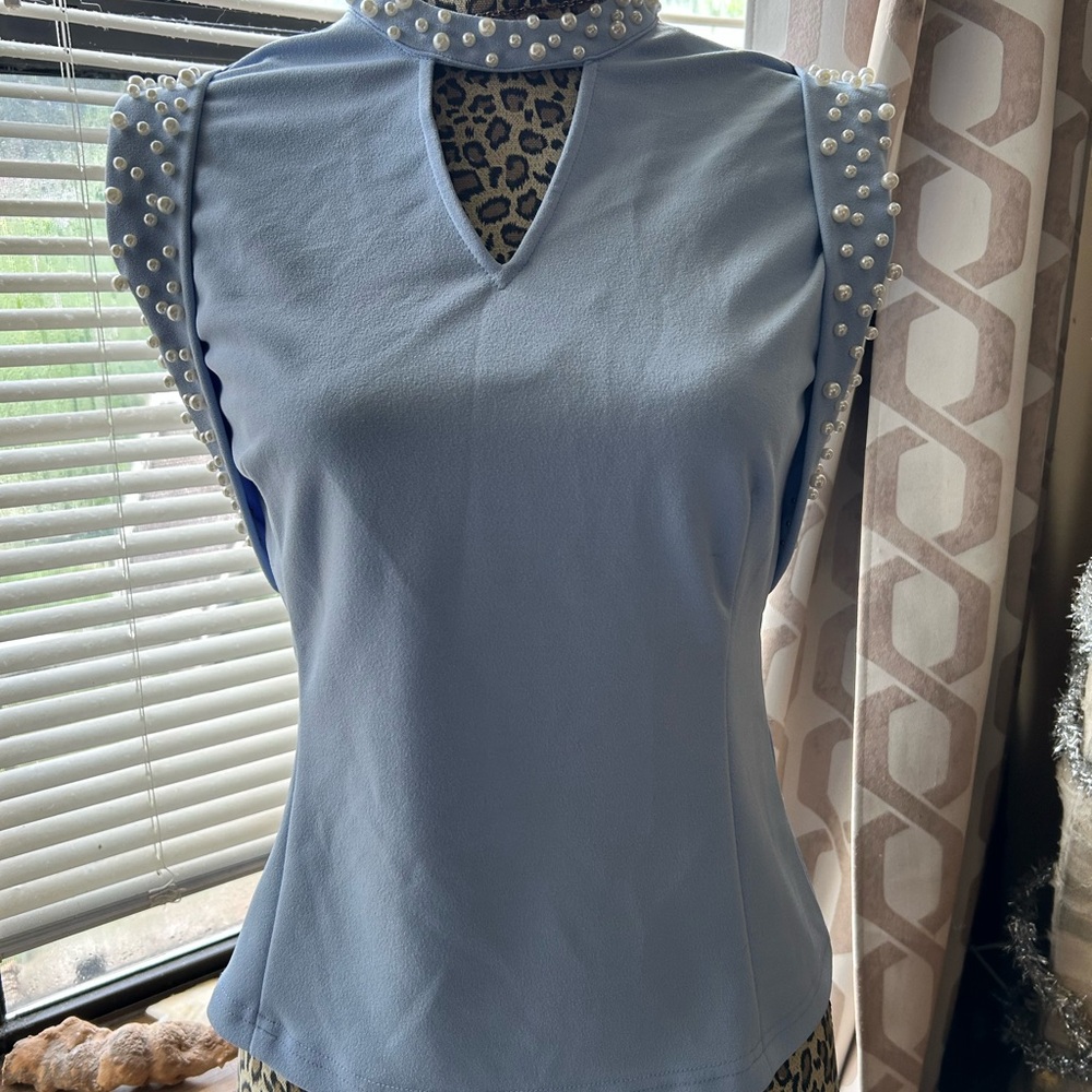 Chic Light Blue Sleeveless Blouse with Pearl Details